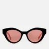 Gucci Women's Acetate Cat Eye Sunglasses with Contrast Arms - Black/White/Orange - Image 1