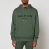 Balmain Men's Printed Hoodie - Green/Black - Image 1